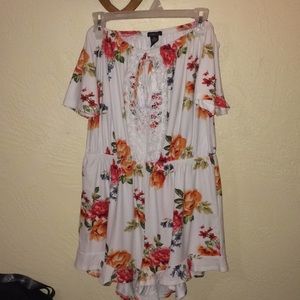 White floral off-the-shoulder romper with lace.